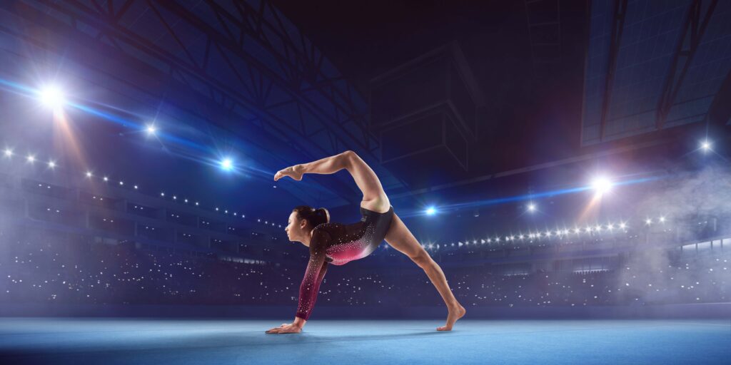 female-gymnast-doing-complicated-trick-gymnastics-balance-beam-professional-arena