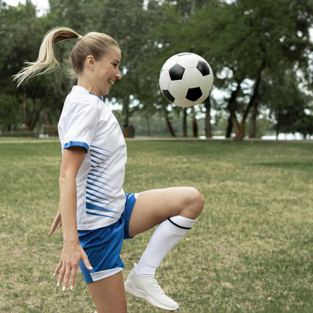 side-view-smiley-woman-training-with-ball